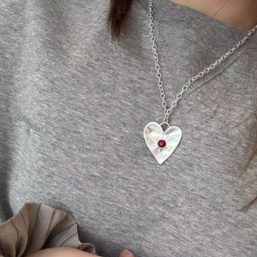 Heart Necklace with Radiant Sun Design