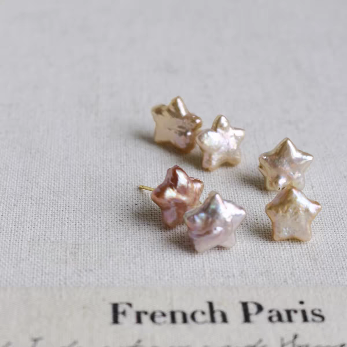 Iridescent pearl star studs